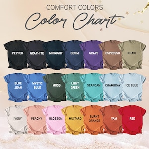 May include: A color chart displays a variety of t-shirts in different colors. The shirts are arranged in rows, with each shirt labeled with its color name, including Pepper, Graphite, Midnight, Denim, Grape, Espresso, Khaki, Blue Jean, Mystic Blue, Moss, Light Green, Seafoam, Chambray, Ice Blue, Ivory, Peachy, Blossom, Mustard, Burnt Orange, Yam, and Red.