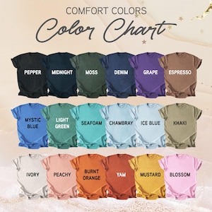 May include: A colour chart presents Comfort Colors t-shirts in a range of shades. The shirts are arranged in rows, displaying colours such as Pepper, Midnight, Moss, Denim, and Grape. The text "Color Chart" is at the top.