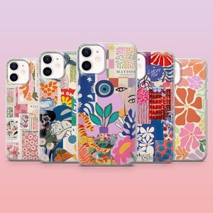 Könnte beinhalten: Eine Sammlung von fünf Handyhüllen mit farbenfrohen, künstlerischen Designs. Die Hüllen weisen verschiedene Muster auf, darunter Blumen, abstrakte Formen und Text. Eine Hülle trägt den Text "MATISSE" und eine andere "LUCKY YOU". Die Hüllen sind auf einem rosa Farbverlaufshintergrund angeordnet.
