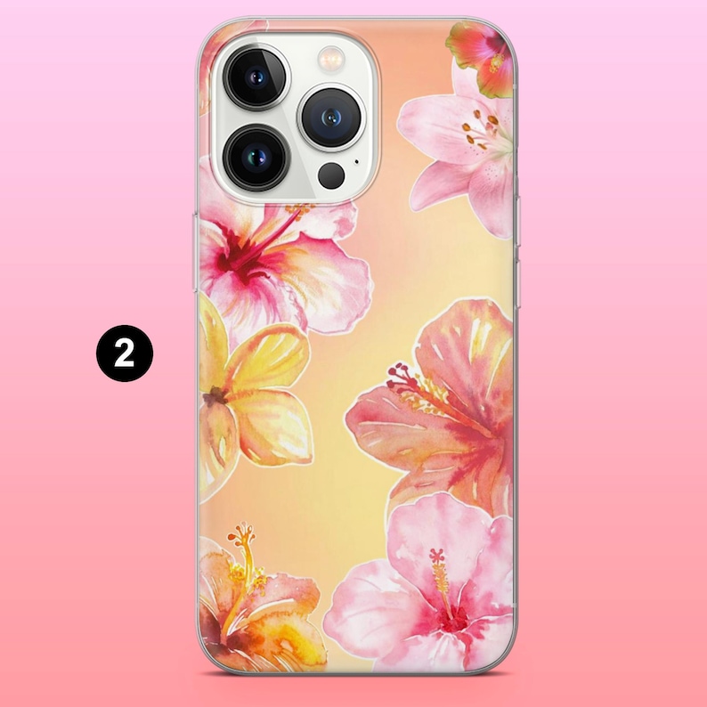 May include: A clear phone case featuring a watercolor design of pink and yellow hibiscus flowers. The case has a gradient background of yellow and orange. The number "2" is in a black circle on the left side of the case.