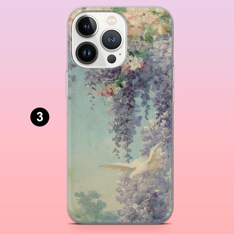 May include: A clear phone case with a floral design featuring a white bird in flight. The flowers are in shades of purple, pink, and white. The case has a camera lens cutout and a clear back.
