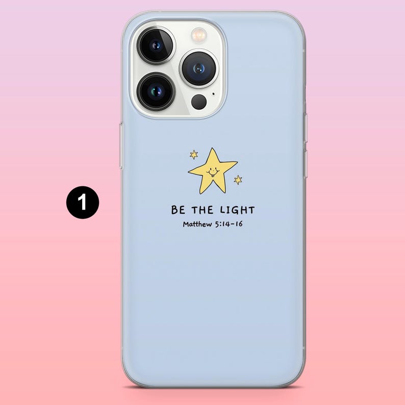 May include: A light blue phone case featuring a yellow smiling star and the text "BE THE LIGHT" with the reference Matthew 5:14-16. The case is designed to fit a smartphone and has a glossy finish.