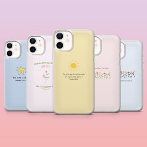 May include: A collection of five phone cases in various pastel colors. Each case features a unique design, including a star, a flower, a sun, and floral patterns, along with inspirational text. The cases are designed to fit a smartphone.