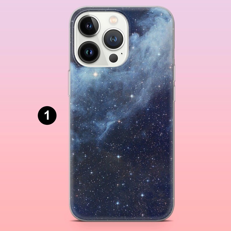 May include: A smartphone case with a cosmic design. The case features a dark blue and black nebula pattern with numerous white stars. The camera lenses are visible at the top. The case is made of a clear, protective material.