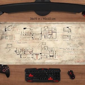 May include: A large rectangular mouse pad with a vintage map design, measuring 36x15 inches. The map features a detailed mansion floor plan with text labels. A black keyboard, mouse, and controller are visible.