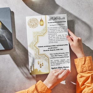 May include: A gold and white invitation card with Arabic calligraphy and decorative lanterns. The card's text reads "In Loving Memory of Our Dear Father" and includes the date, time, and location for a memorial service.