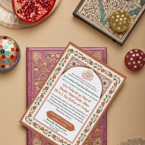 May include: An invitation for an Evening of Spiritual Remembrance with floral border, text in Arabic script, and a decorative book. The image also includes a pomegranate, a small decorative box, and a yellow flower.