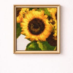 May include: A white ceramic mug with a black handle and the text "But First, Coffee" in a black, handwritten-style font. The mug is on a white surface.