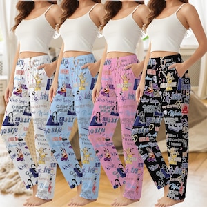 May include: Four pairs of pajama pants in white, light blue, pink, and black, each with a repeating pattern of text, stars, and illustrations. The pants have pockets and a relaxed fit, suitable for sleepwear or lounging.