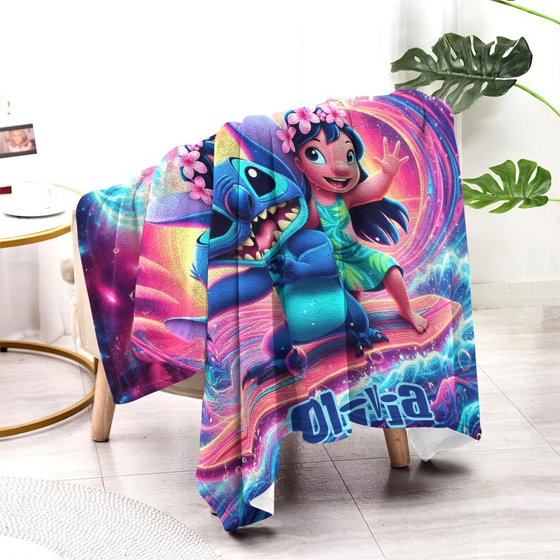 May include: A colorful blanket featuring the characters Stitch and Lilo from the animated movie. The blanket has a vibrant design with a swirling background of pink, purple, and blue. The word "O'hana" is written in blue.
