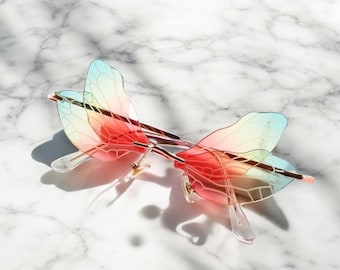 ?Women Orange Dragonfly Wing Shape Frameless Irregular Shades Party Sun Glasses Buy Dragonfly Wing Shape Sunglasses for Women/Men Frameless  main image 2