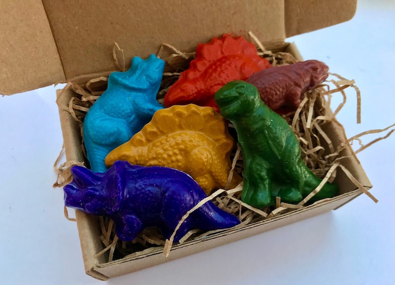 dinosaur crayons set of six dinosaur soy crayons in a box with organic paper shred with colors green orange yellow purple turquoise red