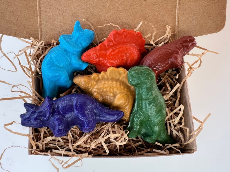 dinosaur crayons set of six dinosaur soy crayons in a box with organic paper shred with colors green orange yellow purple turquoise red