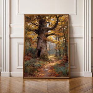 May include: A framed landscape painting of a forest scene, featuring a large oak tree with a hollow in its trunk. The tree's branches are adorned with yellow and orange leaves. A path winds through the forest, bathed in sunlight.