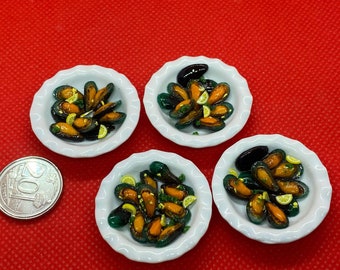 Handmade Miniature steamed mussels with garlic, parsley, chilli and lemon, clay