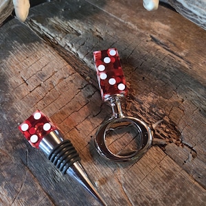 Bottle opener and stopper made with professional style dice. Sold as set.