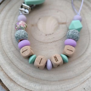 Pacifier chain personalized with name wood and silicone beads including gift bag with desired text as print