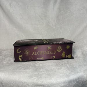 Alchemised by SenLinYu with custom sprayed edges | Dark fantasy book image 2