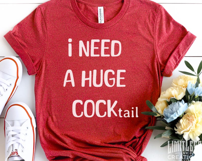 May include: Red t-shirt with white text that reads "i need a huge cocktail".