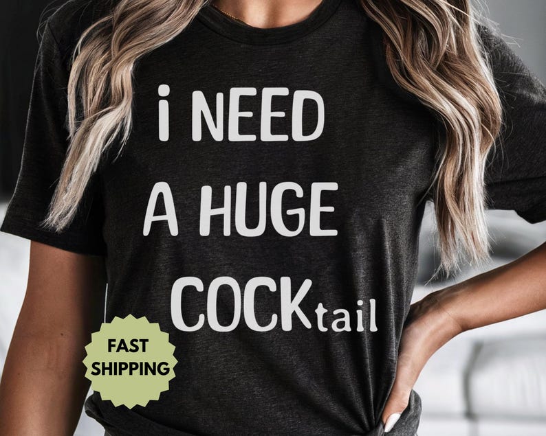 May include: Black t-shirt with white text that reads "I need a huge cocktail".