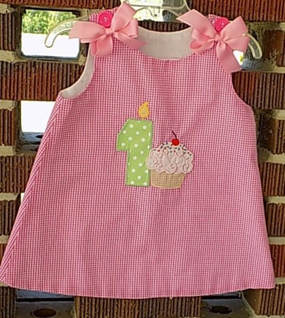 first birthday cupcake dress dress, pink gingham, heat sealed bows Sizes 9 mo Long Sleeve Dresses & Style:BR0446D Size for girl:6-9 months Cupcake enthusiast