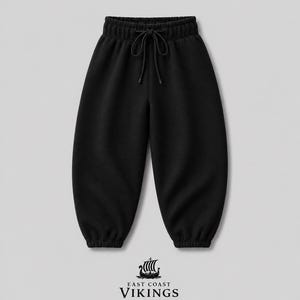 May include: Black sweatpants with a drawstring waist and elastic cuffs. The pants have a relaxed fit and feature the "East Coast Vikings" logo at the bottom. The pants are made of a soft, comfortable material.