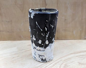 White  Porcelain on Black Clay Vase