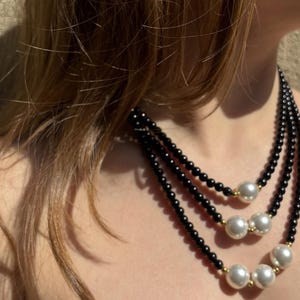 Triple Layer Necklace with Onyx Beads, White Shell Pearls & Gold-Toned Stainless Steel – 16&quot;, 18&quot;, 20&quot;