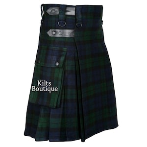 May include: A traditional kilt in a green and navy blue plaid pattern. The kilt features a pocket, leather straps, and the text "Kilts Boutique". The garment is designed with pleats and a belt, showcasing classic Scottish attire.