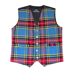 May include: A tartan waistcoat in blue, red, yellow, and black. The waistcoat has a V-neck, a black lining, and four white buttons. The text "Kilts Boutique" is visible on the upper part of the waistcoat.