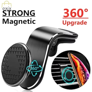 May include: A black magnetic car phone mount with the text "STRONG Magnetic" and "360° Upgrade". The mount has a circular magnetic pad and a clip for attaching to a car vent. A phone is shown attached to the mount in the image.