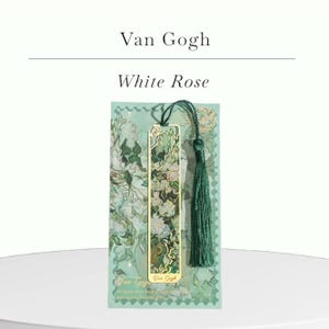 May include: A gold-colored metal bookmark featuring a floral design with a green tassel. The bookmark is set against a green background with the text "Van Gogh White Rose". The design includes white roses and green leaves.