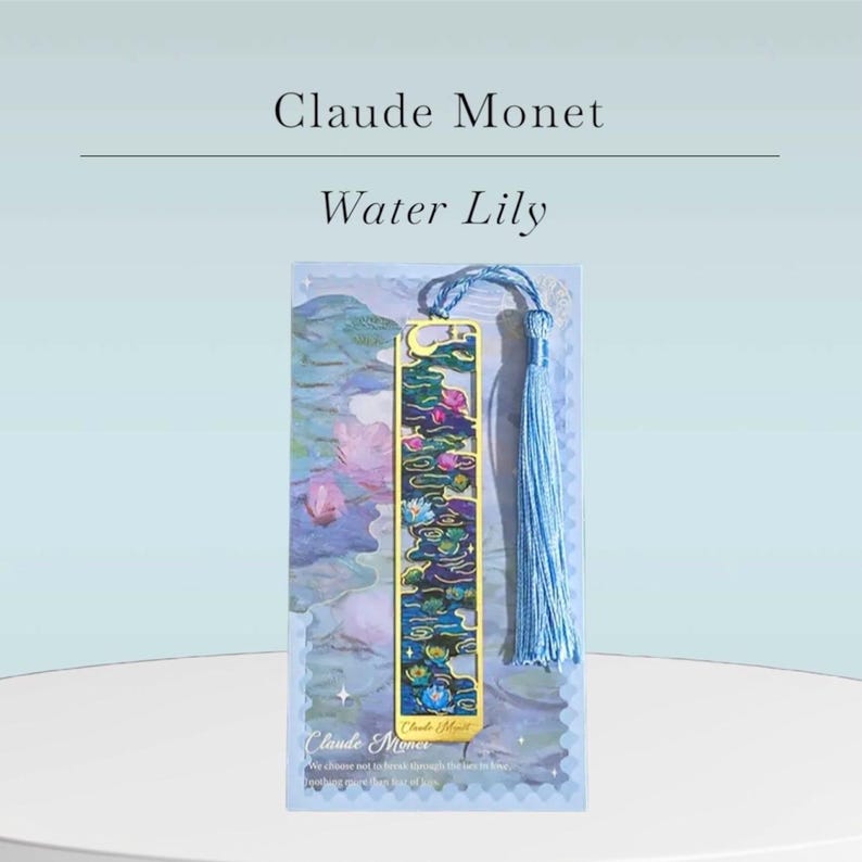 May include: A decorative bookmark featuring a design inspired by Claude Monet's Water Lilies. The bookmark has a gold-colored frame with a blue, green, and pink floral design. It includes a blue tassel and the text "Claude Monet Water Lily".