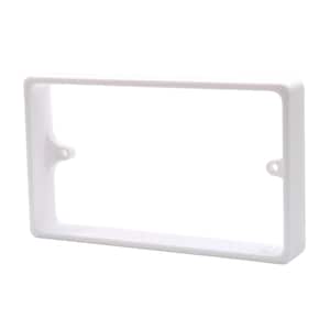 May include: A white rectangular plastic frame with rounded corners. The frame has two small circular holes on the sides. The object is a solid white color and appears to be a mounting bracket or cover.