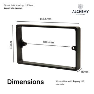 May include: Black rectangular frame with dimensions displayed. The frame has a screw hole spacing of 118.5mm, a width of 146.5mm, and a height of 86mm. The frame is 15mm thick. Text on the image reads "Dimensions" and "Compatible with 2-gang UK sockets."