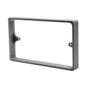 May include: A rectangular, gray frame with rounded corners and a hollow center. The frame has a textured surface and small holes on the sides for mounting. The top edge has a darker, bronze-colored trim. The frame is designed to hold a rectangular object.