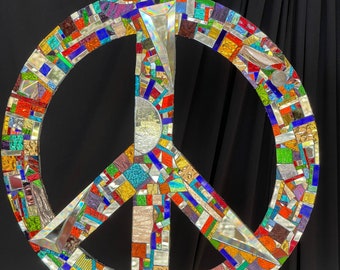 Dazzling 16” mirror mosaic peace sign sun catcher, hang inside or outside. Steel center covered in silver and colored mirror bits