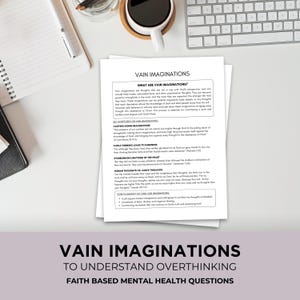 May include: White papers titled "VAIN IMAGINATIONS" with text about overthinking and faith-based mental health. A cup of coffee, a pen, and a keyboard are also visible on the desk.