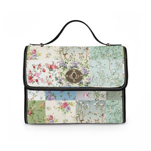 May include: A floral patchwork handbag with a black handle and trim. The bag features a variety of floral patterns in shades of pink, purple, and green. The clasp is gold-toned.
