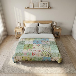 May include: A patchwork quilt with floral patterns in shades of green, blue, pink, and cream covers a bed. The quilt is made of various square patches, each featuring a different floral design. The bed has a wooden headboard and two matching nightstands.