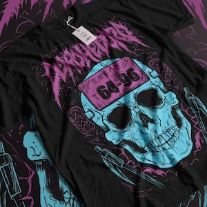 May include: Black t-shirt with a graphic of a blue skull with a pink license plate that says "東京 600 64-96" on its forehead. The skull is surrounded by pink and blue abstract shapes.