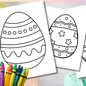 May include: Three white sheets of paper with Easter egg designs for coloring. The eggs have various patterns, including stripes, stars, and wavy lines. The text "30 Easter Egg Colouring Pages" is at the top. Colored crayons are in the lower left corner.