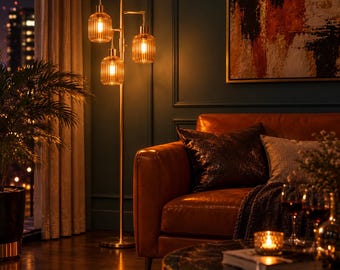May include: A tall floor lamp with a slender gold-toned metal stand and three vertical, ribbed amber glass shades. The lamp emits a warm, glowing light, illuminating the surrounding space with a soft, golden hue.