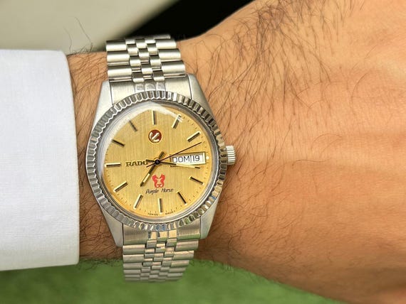 Vintage Rado Purple Horse Automatic Watch: Golden Dial, 25 Jewels