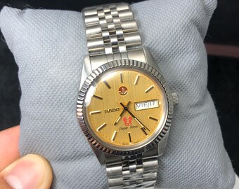 Vintage Rado Purple Horse Automatic Watch: Golden Dial, 25 Jewels