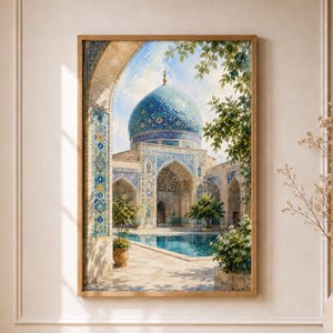 May include: A framed wall art print depicting a mosque courtyard with a large blue tiled dome, intricate geometric tile patterns on the archways, a central reflecting pool, and green trees under a bright sky with soft clouds and sunlight.
