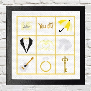 May include: A cross-stitch pattern with nine squares featuring various images, including a tuxedo, a ring, a key, a guitar, a yellow umbrella, a heart, a horse, and the text "You ok?" and "fifteen".