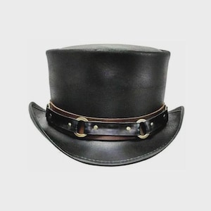 May include: A black top hat with a leather band and gold-colored metal accents. The hat has a wide brim and a tall, cylindrical crown. The band is secured with small rivets. This hat is a classic accessory.