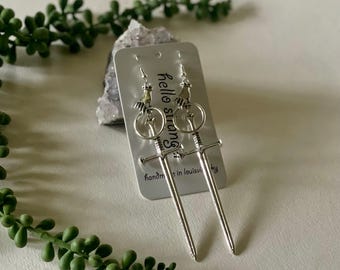 Silver hand with giant sword earrings