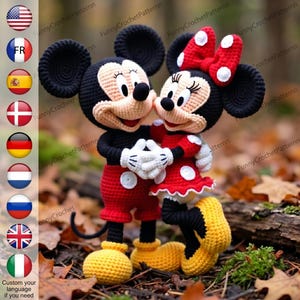 May include: Crocheted Mickey and Minnie Mouse dolls. Mickey wears red shorts, black shoes, and yellow feet. Minnie wears a red polka-dot dress, a red bow, and yellow shoes. Both dolls have black ears and are hugging each other.